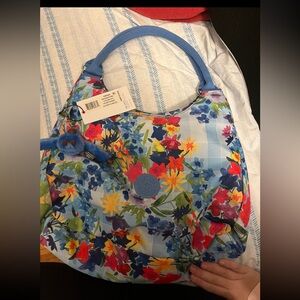 Kipling floral picnic in the park